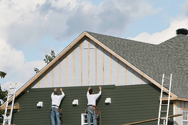 Professional Emergency Siding Repair technician working in Loretto, TN